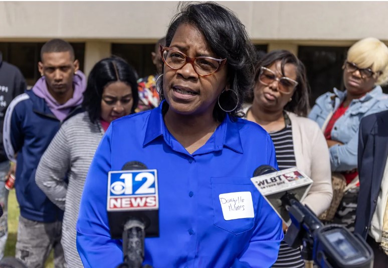 Danyelle Holmes, of the Mississippi Poor People's Campaign, far right, speaks during a Mississippi Rapid Response Coalition press conference about Jackson's water issues at the Mississippi E-Center at Jackson State University in Jackson, Miss., Wednesday, March 22, 2023. Credit: Eric Shelton/Mississippi Today