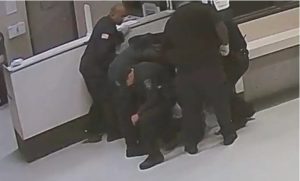 Officers piled on top of Robert Loggins at 6:04 a.m. on Nov. 29, 2018. They remained there for more than three minutes, and when they got up, Loggins didn’t move. Six minutes later, someone finally checked his pulse. He had none. Credit: Photo from Grenada County Jail video/MCIR