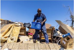 Nate Richards tries to salvage what is left at his sister's home after Friday night's tornado in Silver City, Miss., Saturday, March 25, 2023. (Eric J. Shelton/Mississippi Today) Credit: Eric Shelton/Mississippi Today