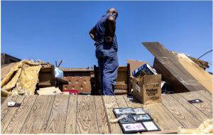 Nate Richards tries to salvage what is left at his sister's home after Friday night's tornado in Silver City, Miss., Saturday, March 25, 2023. Credit: Eric Shelton/Mississippi Today