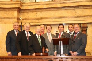 Pictured (l tor r) are Speaker of the House Philip Gunn, Rep. Gene Newman, Rep. Tom Weathersby, Rep. Price Wallace, Rep. Fred Shanks, Rep. Lee Yancey, Rep. Tom Miles and Rep. Brent Powell.
