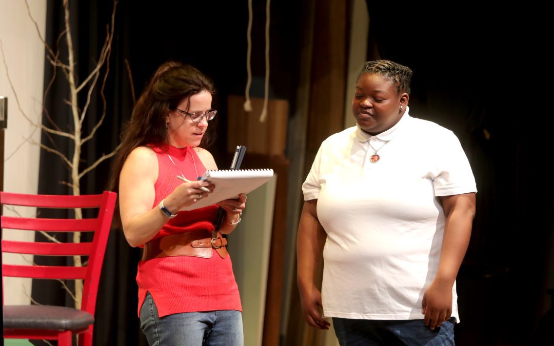 Longtime Theatre and Drama Director Alison Stafford works with a student cast member of "The Spitfire Grill."