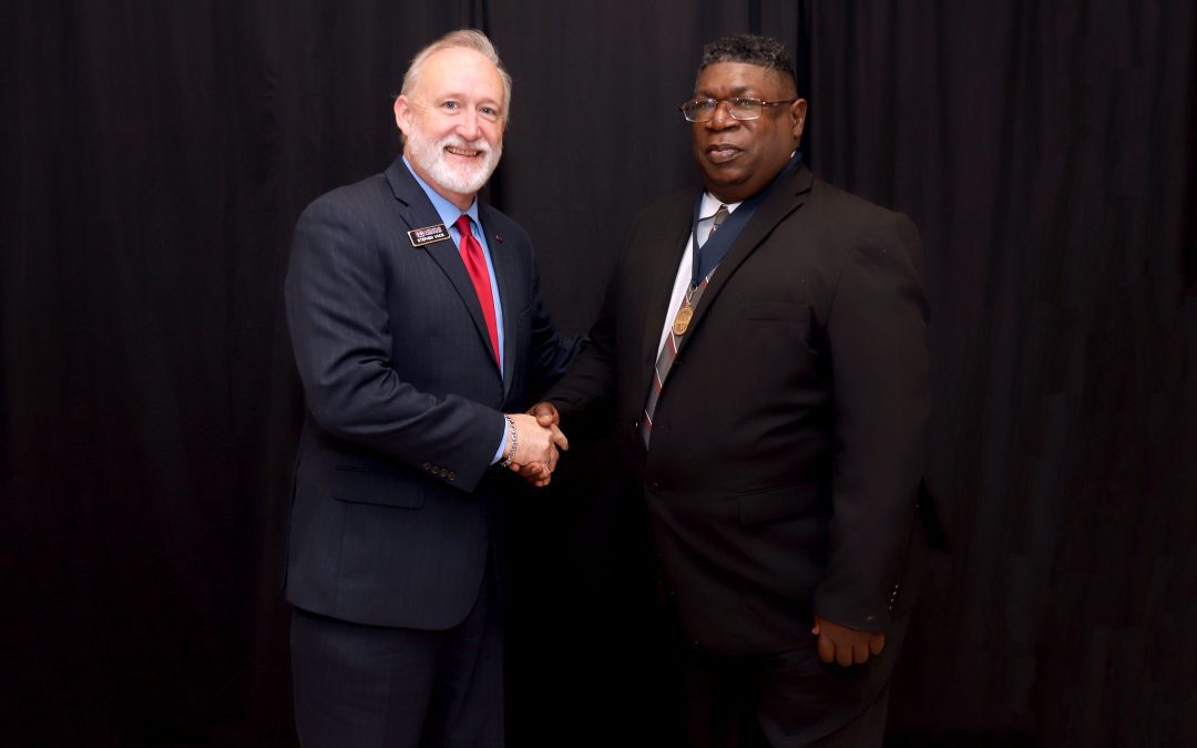 Retired baseball Coach George McQuitter, right, was inducted into the Mississippi Community and Junior Colleges Sports Hall of Fame on April 25. Congratulating him is Hinds President Dr. Stephen Vacik.