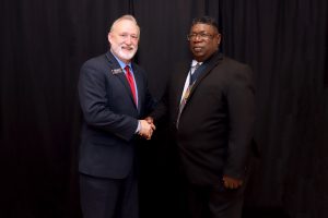 Retired baseball Coach George McQuitter, right, was inducted into the Mississippi Community and Junior Colleges Sports Hall of Fame on April 25. Congratulating him is Hinds President Dr. Stephen Vacik.