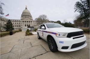 Capitol Police and the Mississippi State Highway Patrol increased security around the Mississippi State Capitol in Jackson, Miss., Wednesday, Jan. 20, 2021. (AP Photo/Rogelio V. Solis)