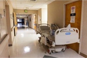 An empty hospital bed sits in an empty hallway of a closed area of the Delta Health System in Greenville, Miss., Tuesday, February 14, 2023. Credit: Eric J. Shelton, Mississippi Today