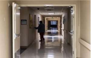 A healthcare worker walks down an empty hallway in a closed area of the Delta Health System in Greenville, Miss., Tuesday, February 14, 2023. Credit: Eric J. Shelton, Mississippi Today