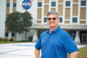 NASA Technical Manager Tom Lipski stands in front of the Roy S. Estess Building at NASA’s Stennis Space Center. The technical manager reviews new technology reports to ensure contract compliance. Additionally, he connects with university students in Mississippi and Louisiana to discuss NASA-proven technologies while encouraging entrepreneurship to use those technologies. Photo Credit: NASA/Danny Nowlin