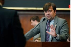 State Rep. Nick Bain, R-Corinth, right, answers a question from Rep. Edward Blackmon Jr., D-Canton, during a discussion over a bill that would ban gender affirming care for Mississippians 18 and under. Photo taken on Thursday, Jan. 19, 2023. (AP Photo/Rogelio V. Solis)
