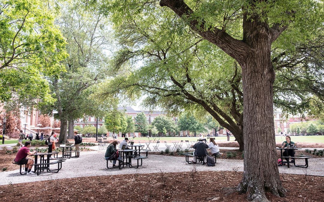 Students enjoy a new outdoor seating space between Lee Hall and Colvard Student Union. (Photo by Megan Bean)