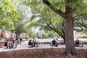 Students enjoy a new outdoor seating space between Lee Hall and Colvard Student Union. (Photo by Megan Bean)