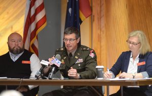 U.S. Army Corps of Engineers representatives Brandon Davis (left) with Christopher Klein (center) and Robyn Colosimo, discuss proposed Pearl River flood control options and field questions, during a public meeting held at the Mississippi Agriculture and Forestry Sparkman Auditorium in Jackson, Wednesday, May 4, 2023. Credit: Vickie D. King/Mississippi Today