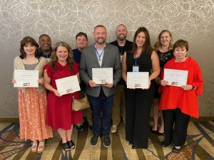 Itawamba Community College representatives at the College Public Relations Association of Mississippi special event where the staff received multiple awards include front, from left, Morgan Henry, Maggie Caldwell, C.J. Adams, Nina Strother, Donna Thomas; back, Raphael Henry, Adam Gore, Lee Adams and Margaret Todd.