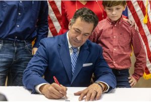 State Sen. Chris McDaniel signs qualifying paperwork after announcing that he is running for lieutenant governor at the Mississippi Republican Party Headquarters in Jackson, Miss., January 30, 2023. Credit: Eric Shelton/Mississippi Today