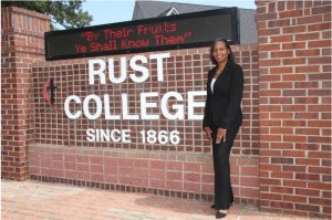 Ivy Taylor, president of Rust College, stands in front of the school's motto. Credit: Courtesy Rust College