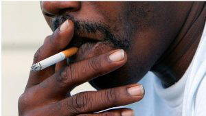 A man smokes a cigarette. 4,500 Mississippians die each year from smoking related diseases.(AP Photo/Ric Feld)