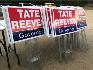 Tate Reeves has blanketed the state with signs, like these at his March campaign kickoff. Credit: Adam Ganucheau | Mississippi Today