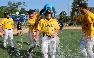 During his postgame radio interview, Southern Miss coach Scott Berry received an icy bath from his celebrating Southern Miss players after the Golden Eagles won the Auburn Regional, defeating Penn 11-7. Credit: Sean Smith/SM2