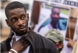Michael Jenkins holds his neck as he attempts to answer questions from his attorney during a press conference near the University of Mississippi Medical Center in Jackson, Miss., Wednesday, Feb. 15, 2023. Jenkins' lawyer claims that Jenkins and Terrell Parker were assaulted by Rankin County sheriff deputies, which left him with serious injuries. Credit: Eric Shelton/Mississippi Today