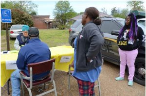 Anguilla resident Victoria Jackson (right), was still seeking assistance after being displaced by an earlier storm before another tornado hit Sharkey County last Friday. She waited in line to fill out relief forms with a FEMA representative near Anguilla's town hall, Wednesday, March 29, 2023.