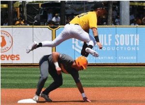 Southern Miss shortstop Dustin Dickerson (10) attempts to turn a double play against Tennessee during an NCAA Super Regional Sunday, June 11, 2023, in Hattiesburg, Miss. (Aimee Cronan/The Gazebo Gazette via AP)