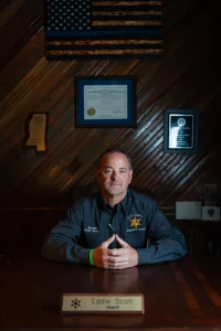 Sheriff Eddie Scott sits for a portrait in his office in West Point, Miss., on June 29, 2023.
