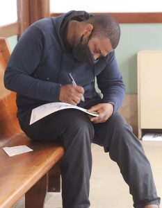 A voter fills out his absentee ballot at the Hinds County Courthouse Saturday in Jackson. Voters waited in a long line for 2 to 3 hours to cast their ballots. Credit: Vickie D. King/Mississippi Today