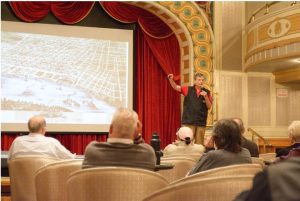 Lee Hendrix teaches passengers about Mississippi River history in the American Queen’s Grand Saloon May 27, 2023. Credit: Keely Brewer, Daily Memphian