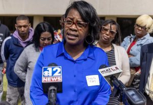 Danyelle Holmes, of the Mississippi Poor People's Campaign, center, speaks during a Mississippi Rapid Response Coalition press conference about Jackson's water issues at the Mississippi E-Center at Jackson State University in Jackson, Miss., Wednesday, March 22, 2023. Credit: Eric Shelton/Mississippi Today