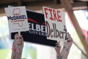 Supporters of Republican candidate for lieutenant governor State Sen. Chris McDaniel wave their signs at the Neshoba County Fair in Philadelphia, Miss., Wednesday, July 26, 2023. McDaniel faces incumbent Lt. Gov. Delbert Hosemann and another opponent for the nomination in the party primary Aug. 8. (AP Photo/Rogelio V. Solis)