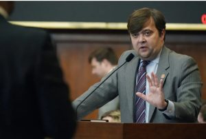 State Rep. Nick Bain, R-Corinth, right, answers a question from Rep. Edward Blackmon Jr., D-Canton, during a discussion over a bill that would ban gender affirming care for Mississippians 18 and under. Photo taken on Thursday, Jan. 19, 2023. (AP Photo/Rogelio V. Solis)