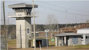 In this March 20, 2019, photo, a watch tower stands high on the grounds of the Central Mississippi Correctional Facility in Pearl, Miss. (AP Photo/Rogelio V. Solis)