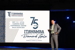 Itawamba Community College President Dr. Jay Allen extends an invitation to the 75th Diamond Anniversary Gala which was announced during Convocation 2023.