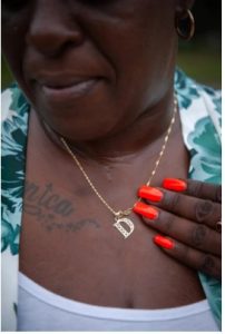 Monica Lee wears a necklace dedicated to her late son, Damien Cameron, in Braxton, Miss. on July 30, 2023. Credit: Rory Doyle for The New York Times