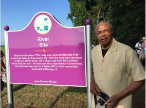 Wheeler Parker, stands in this 2018 photo, beside a marker commemorating where the body of his cousin Emmett Till was removed from the river in 1955