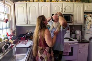 Tim and Crystal Dotson have a moment in their kitchen in Corinth, Miss., Friday, July 21, 2023. After tests were conducted on several homes in the town, the Dotson's home proved to have the most evidence of Per- and polyfluoroalkyl substances, PFAS.