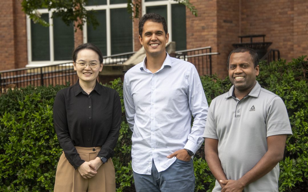 From left to right, Xin Zhang, Vitor S. Martins and Nuwan Wijewardane, MAFES scientists and assistant professors in Mississippi State's Department of Agricultural and Biological Engineering, are building high-tech tools to maintain soil health through a grant from the National Institute of Food and Agriculture. Postdoctoral fellow Lucas Ferreira, not pictured, also supporting all aspects of the research project. (Photo by Dominique Belcher)