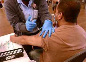 Rufino Galeana is vaccinated against Covid19 during a free event held at New Horizon Church International in partnership with the Mississippi State Department of Health, Wednesday, August 4, 2021 in Jackson. The Pfizer and Moderna vaccines were available to those 12 years of age and older. Credit: Vickie D. King/Mississippi Today