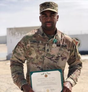 Kelvin Franklin, seen here holding a “medal commendation” certificate,, has filed a federal abuse-related lawsuit against Ian Indianola officer who is accused of shooting an 11-year-old. Credit: Courtesy of Kelvin Franklin