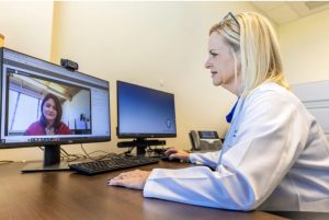 Family nurse practitioner Kristi H. Goodson talks with Karla Beard, a registered nurse with the Choctaw County School District, during a telehealth call at the C Spire corporate building in Ridgeland, Miss., Thursday, September 21, 2023. Credit: Eric Shelton/Mississippi Today