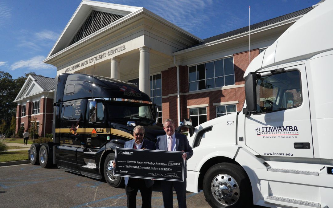 Dr. Allen and Mr. Wanek in front of the trucks