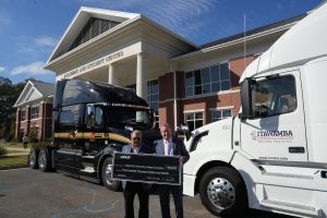 Dr. Allen and Mr. Wanek in front of the trucks