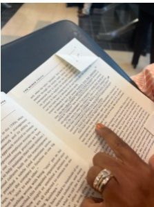 Dawn McLin, the faculty senate president at Jackson State, reads a passage from a book about corporate management called “Absolute Honesty” at an IHL board outside closed doors where JSU presidential finalists were interviewed Oct. 10, 2023