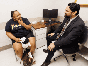 Vann, a patient of Dr. Omar Chohan, is examined during a checkup following surgery to implant a device in her brain to help prevent seizures. She is the first in Mississippi to receive the device.