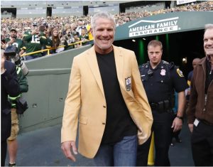 Former Green Bay Packers quarterback Brett Favre smiles as he arrives for a halftime ceremony of an NFL football game against the Dallas Cowboys in 2016 in Green Bay, Wis. (AP Photo/Matt Ludtke)