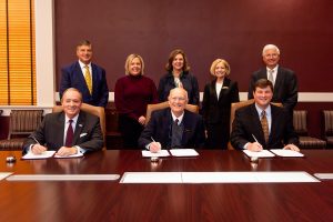 MSU President Mark E. Keenum, seated left, joined Luckyday Foundation Board Chair Jamie Houston and MSU Vice President for Development and Alumni John Rush in signing a Memorandum of Agreement today [Nov. 1] signifying a $4 million Luckyday gift to the university toward construction of Azalea Hall, a 159,000-square-foot student residential complex with 412 beds. Within the new facility will be the Luckyday Tower, a freshman living and learning community for MSU's Luckyday Scholars. Additional Luckyday Board of Managers members in attendance were, standing from left, Jerry Host, vice chair; Kristin R. Merrell, secretary; Mary Preston Dubberly; Patricia G. Smith, executive director; and Granville Tate. (Photo by Grace Cockrell)