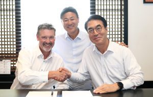 Robert Taylor (left), President and COO of the Taylor Group of Companies; Stan Park (center), President, HD Hyundai Construction Equipment North America; and Choi Cheol-gon, CEO, Hyundai Construction Equipment, celebrate the expansion in Kentucky and Mississippi of Taylor Construction Equipment’s dealership territory.