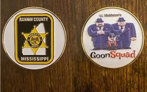 A commemorative coin that Goon Squad members carried. One side shows gangsters and name-checks a supervisor.