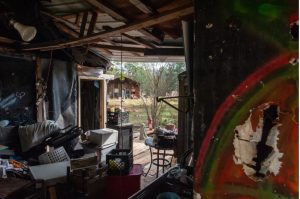 A home remains abandoned following fire damage in the Robinhood neighborhood near Brandon, Miss., on Nov. 24, 2023. The previous occupants allege the Rankin County Sheriff’s Department frequently harassed them at the property