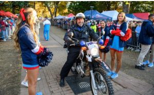 A University Police Department officer helps patrol the Grove and clear the Walk of Champions for the team walk-through before an Ole Miss football game. The university is launching a new certificate program in evidence-based policing and reform to help improve the relationship between law enforcement units and the communities they serve. Photo by Thomas Graning/Ole Miss Digital Imaging Services